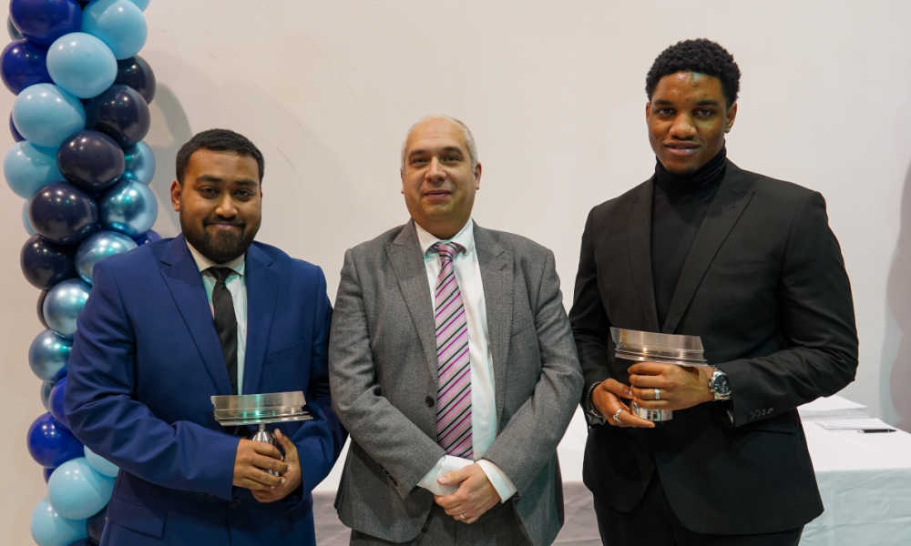 Joseph Ehigie and Umid Uddin being presented their Apprentice of the Year Awards by Luke Vincett of Texcel 